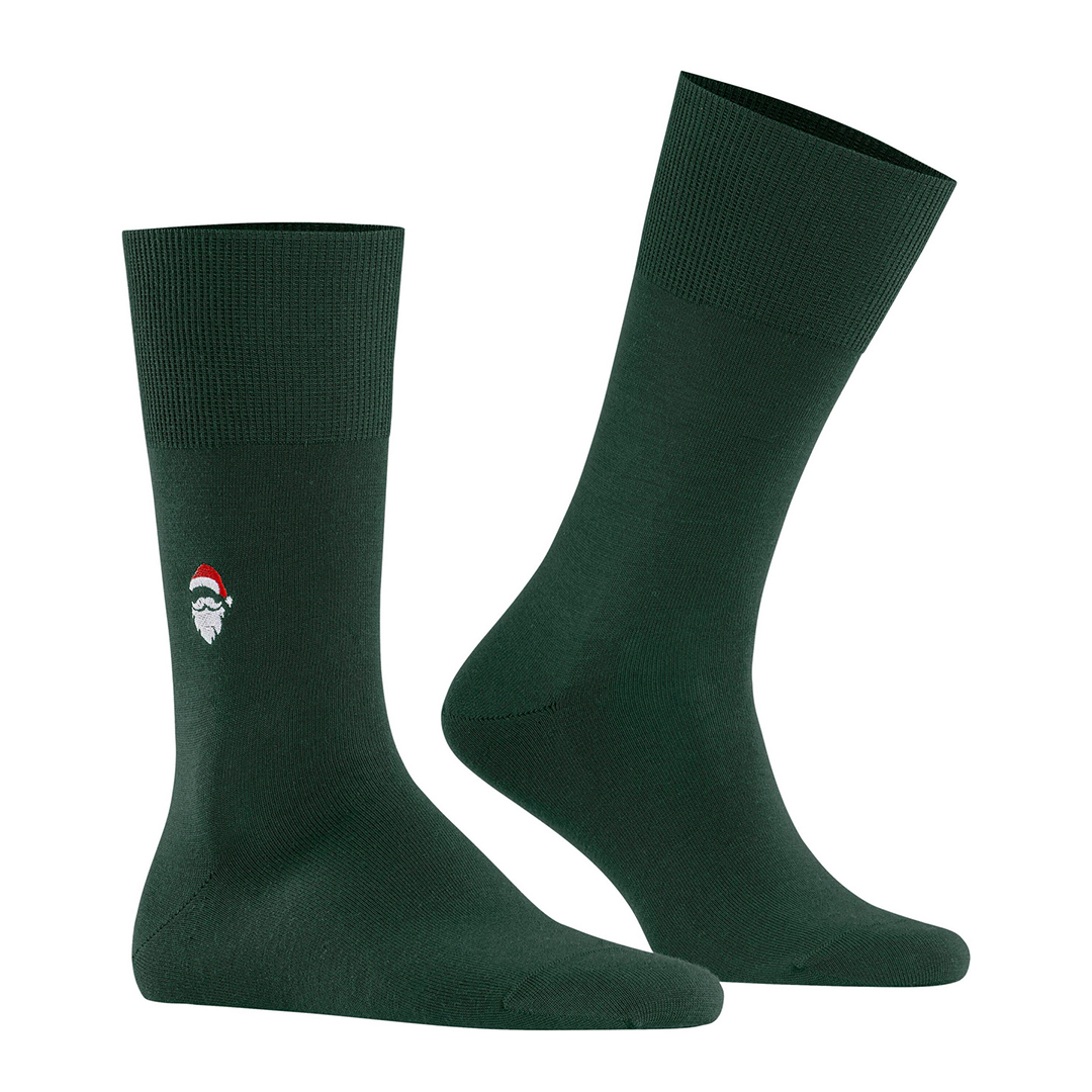 Donkergroene sokken met kerstmanlogo op de enkel