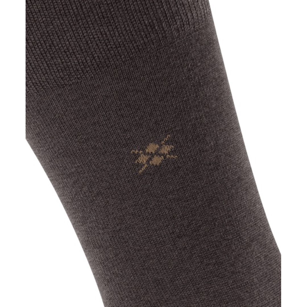Bruine nette sok, close-up van gebreide stof met klein logo
