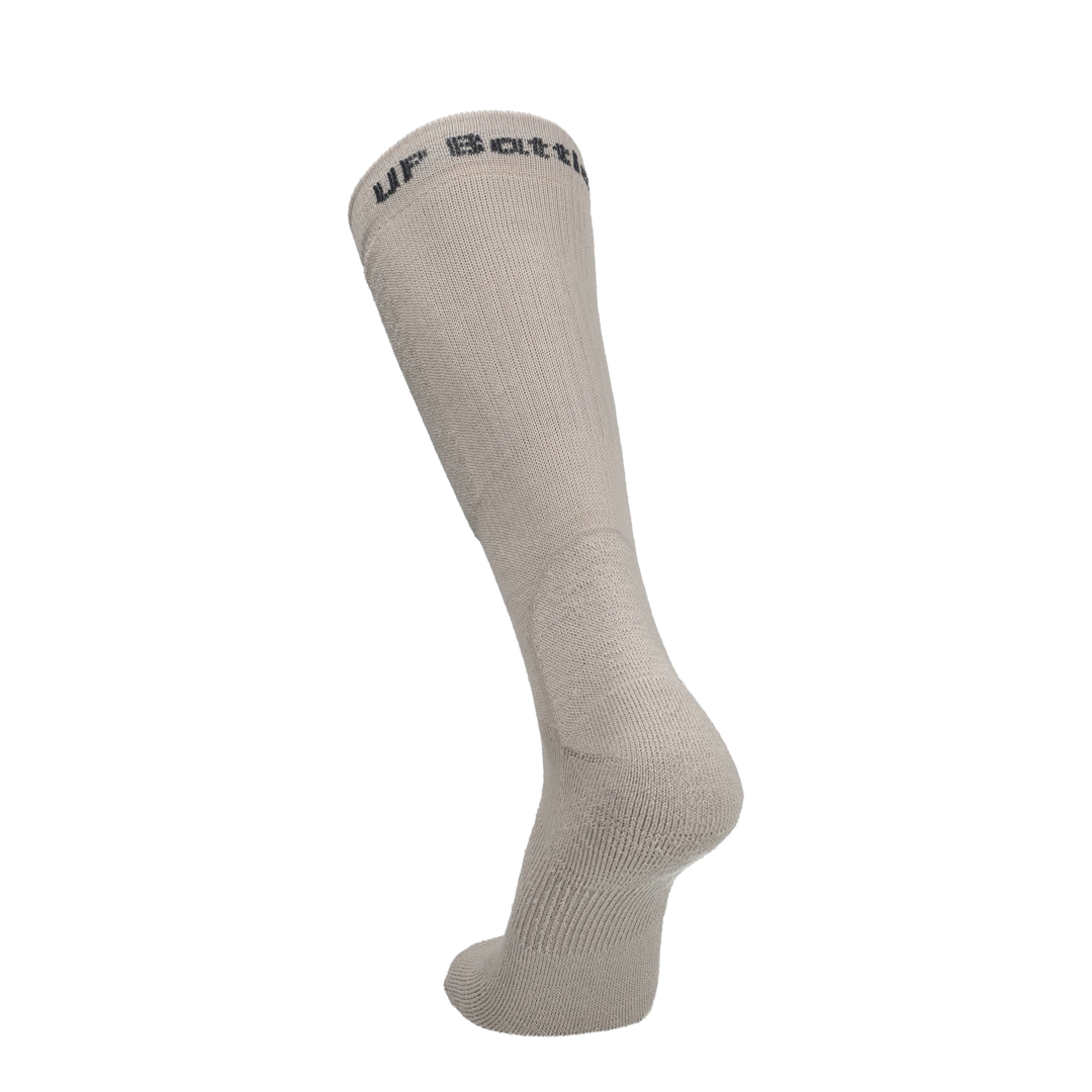Beige merino tactische sok, enkel- en hielgedeelte met merkprint bovenaan